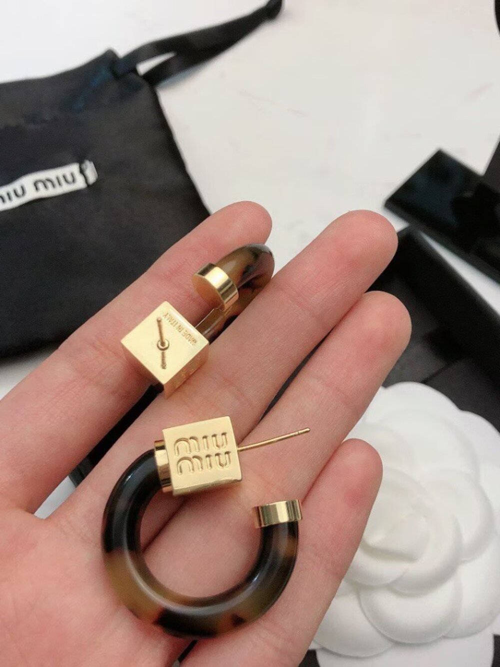 Miu Miu Tortoiseshell Lucite Hoop Earrings with Gold-Logo Accents - Picture 2 of 6